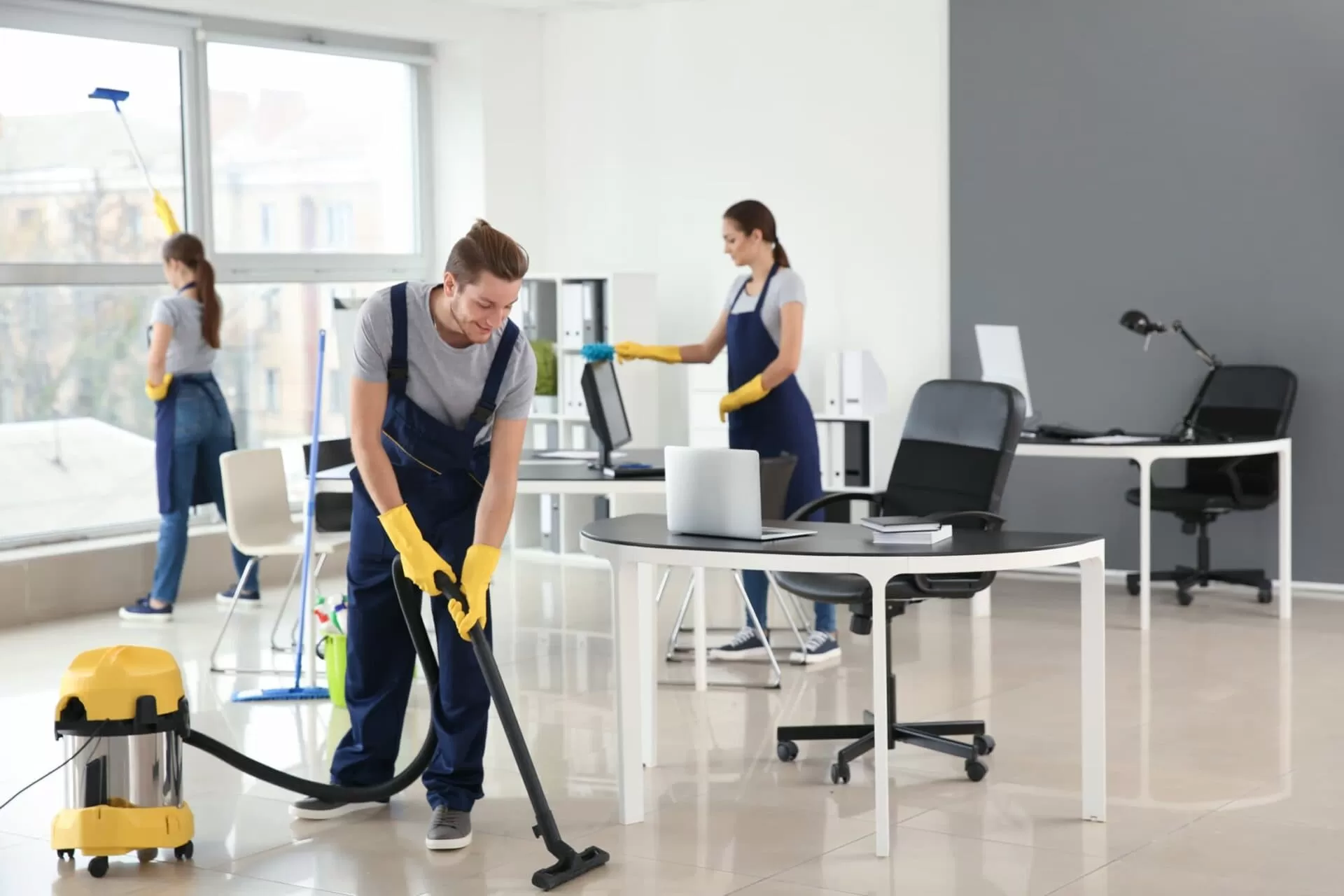 Team of cleaners in commercial office building