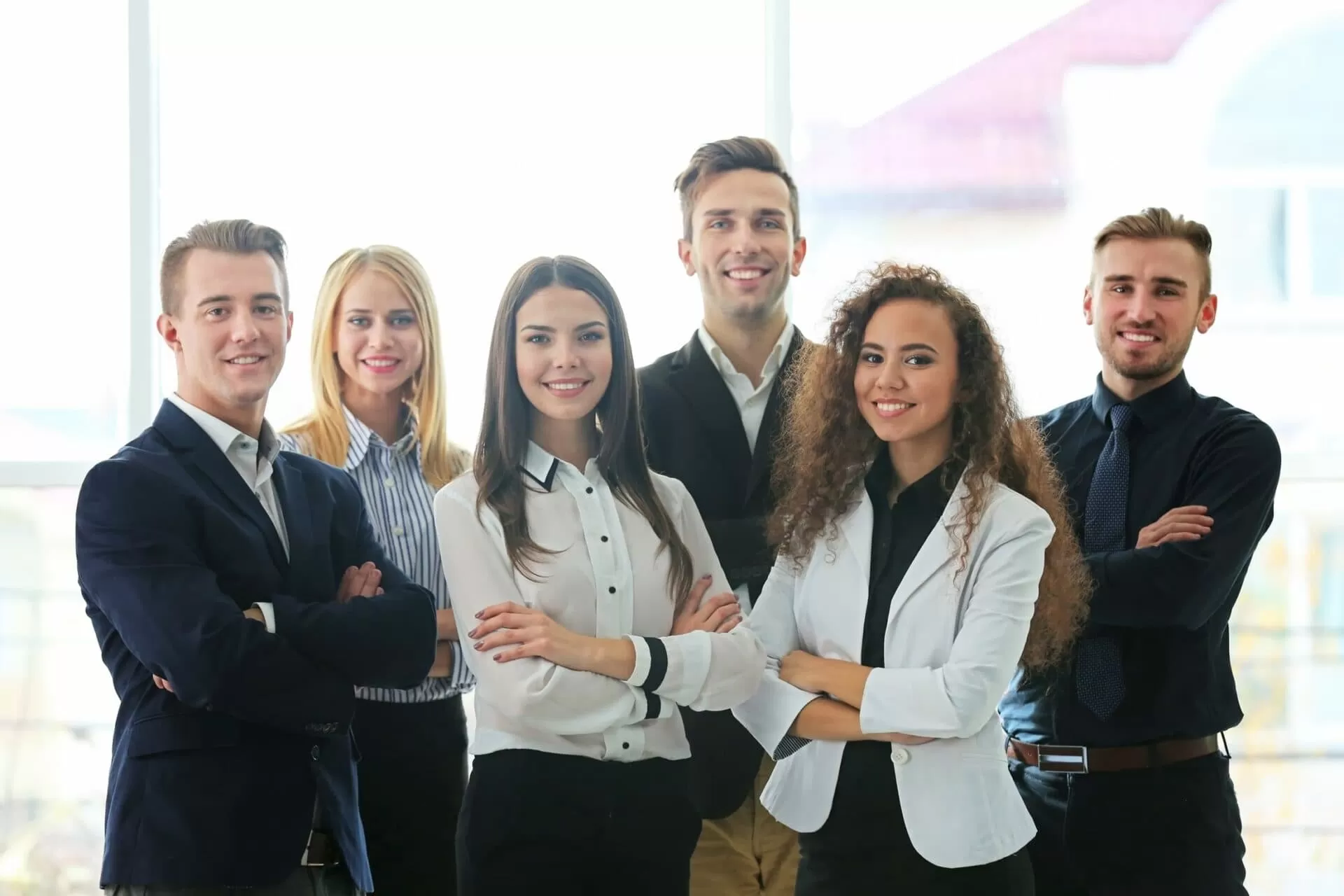 Team photo of business professionals in office environment